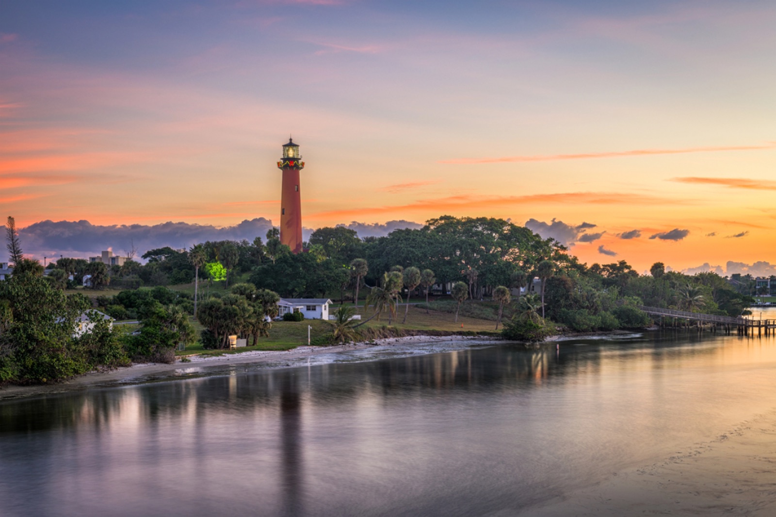 Jupiter Inlet Lighthouse at sunset over the water